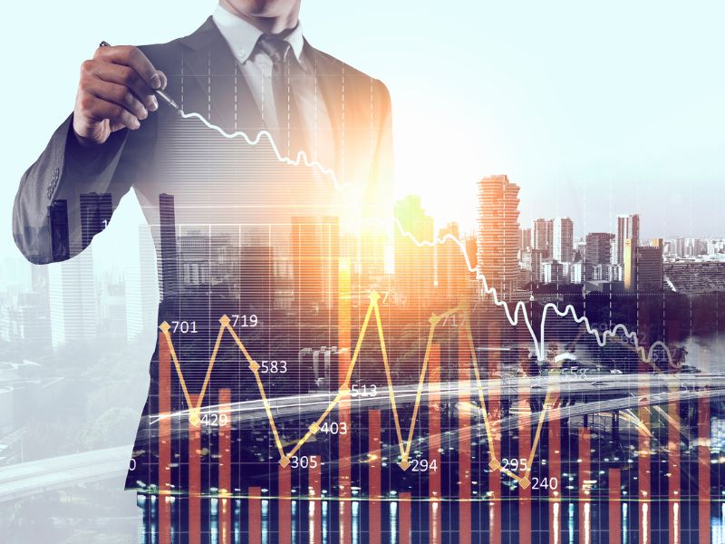 LedgerLogix Growth Forecasting A futuristic business concept image where a professional in a dark setting is typing on a keyboard, with glowing data points, digital graphs, and financial analytics overlaid. The visual conveys the concept of financial technology, predictive analytics, and strategic forecasting in business growth.