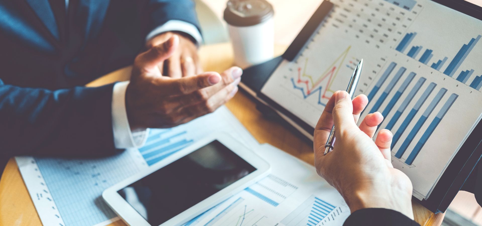 LedgerLogix Small Business Financial Review Financial experts evaluating small business financial reports and growth strategies, showcasing LedgerLogix’s financial review services for entrepreneurs.