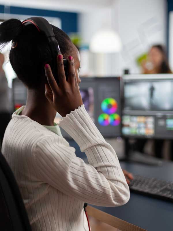 Women with a headset at monitors