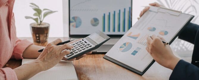 Two people working together looking at business growth