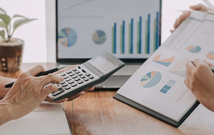 Two people working together looking at business growth